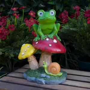 Alpine Corporation ZEN390SLR-S Frog on Mushroom Statue with LED Lights, Solar-Powered LED Frog Garden Statue, 12" H, Green