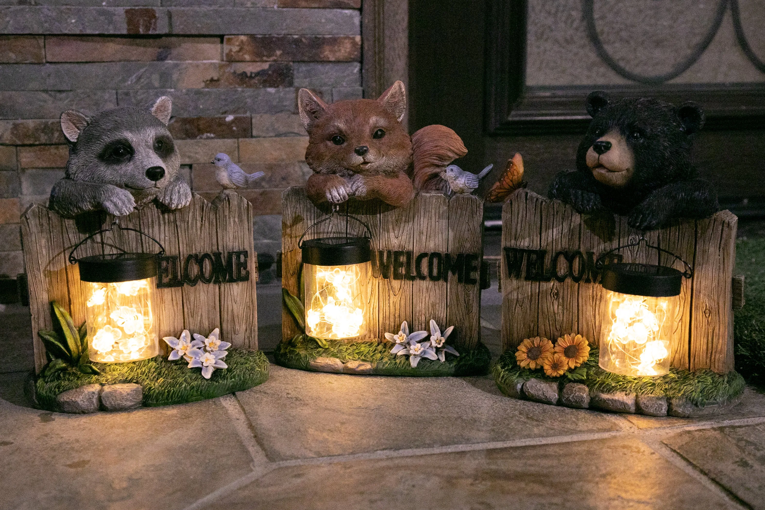 Solar Hand Painted Fox Garden Statue with a Lantern Jar of LED Bumblebees by a Welcome Fence, 9.5 by 11 Inches