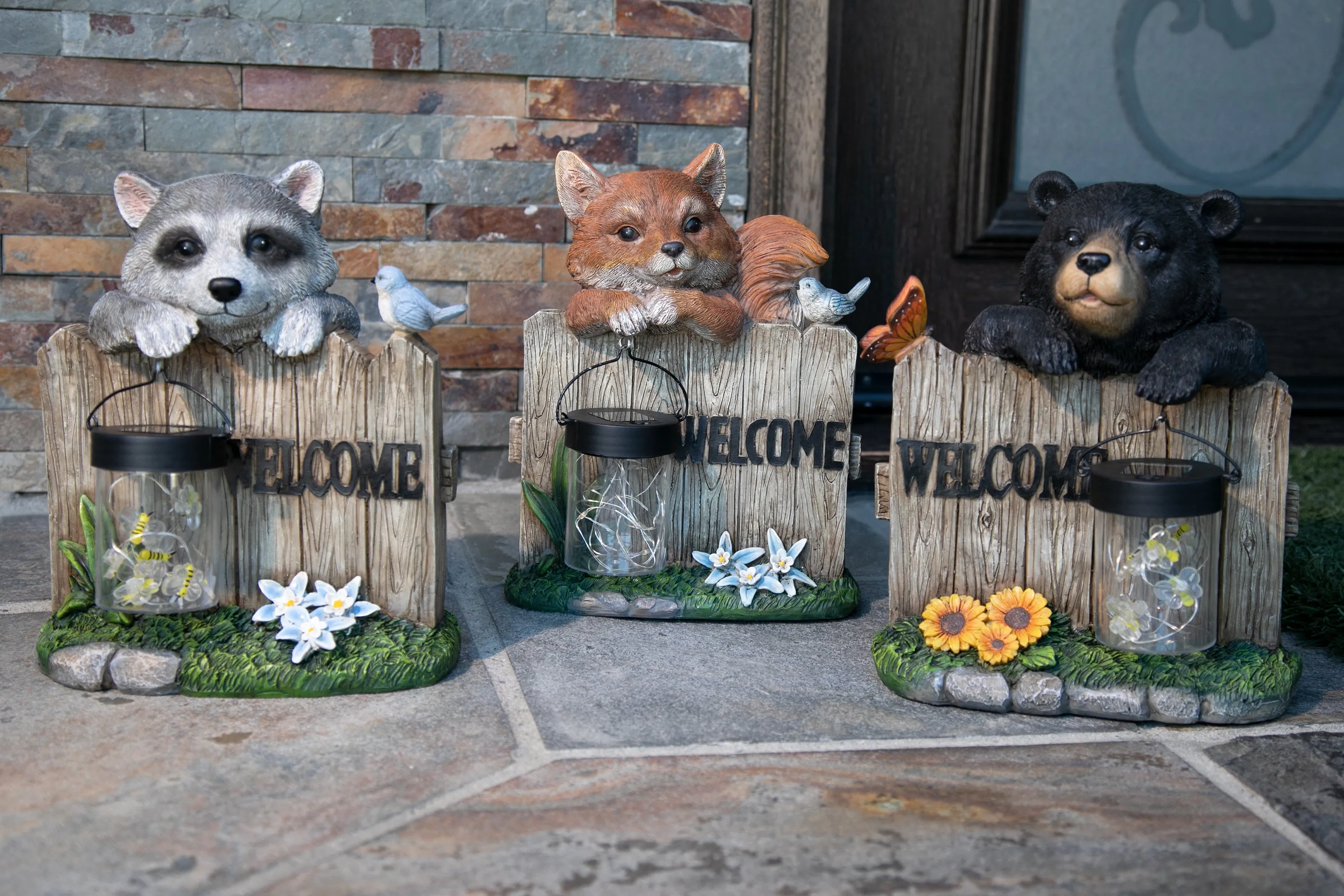 Solar Hand Painted Fox Garden Statue with a Lantern Jar of LED Bumblebees by a Welcome Fence, 9.5 by 11 Inches