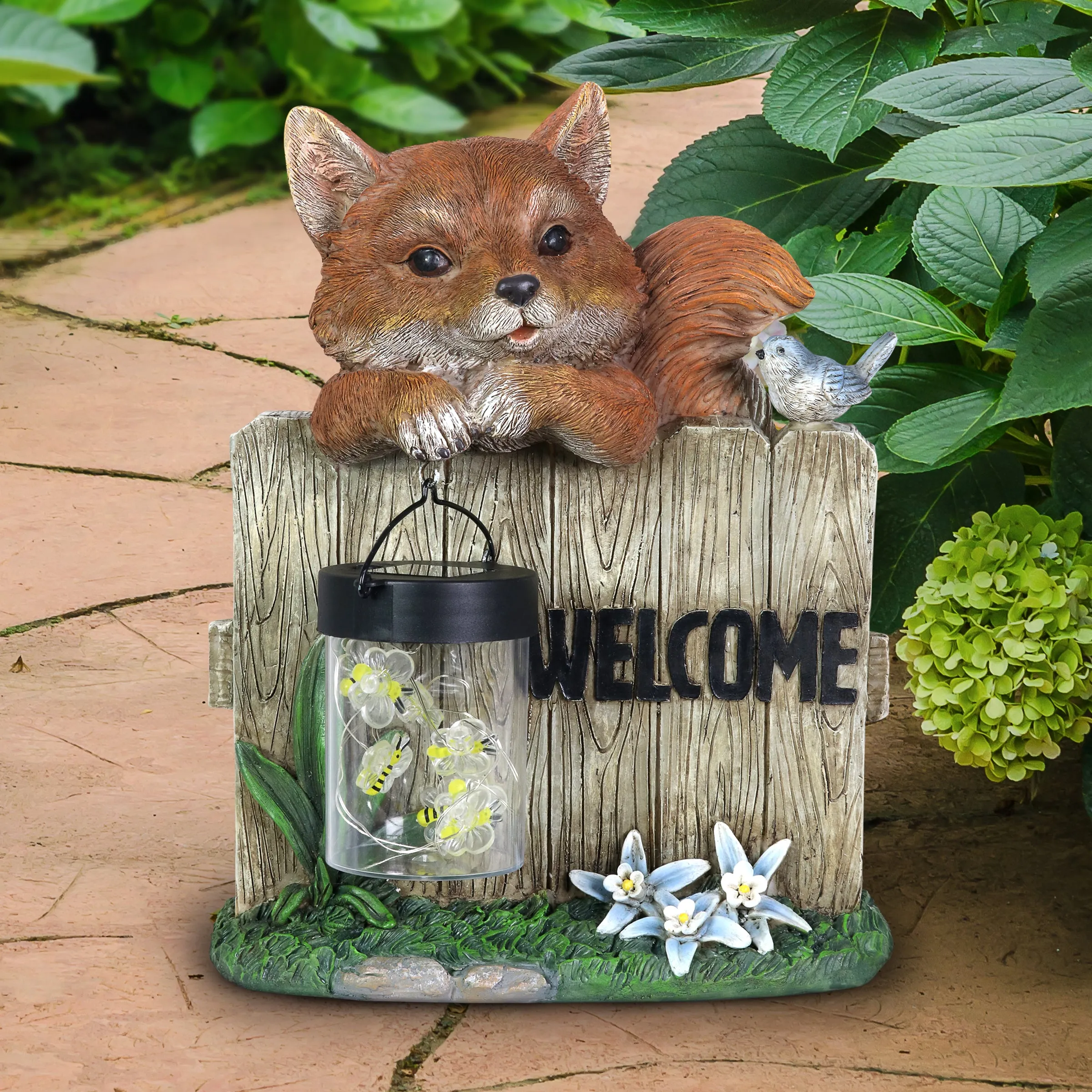 Solar Hand Painted Fox Garden Statue with a Lantern Jar of LED Bumblebees by a Welcome Fence, 9.5 by 11 Inches